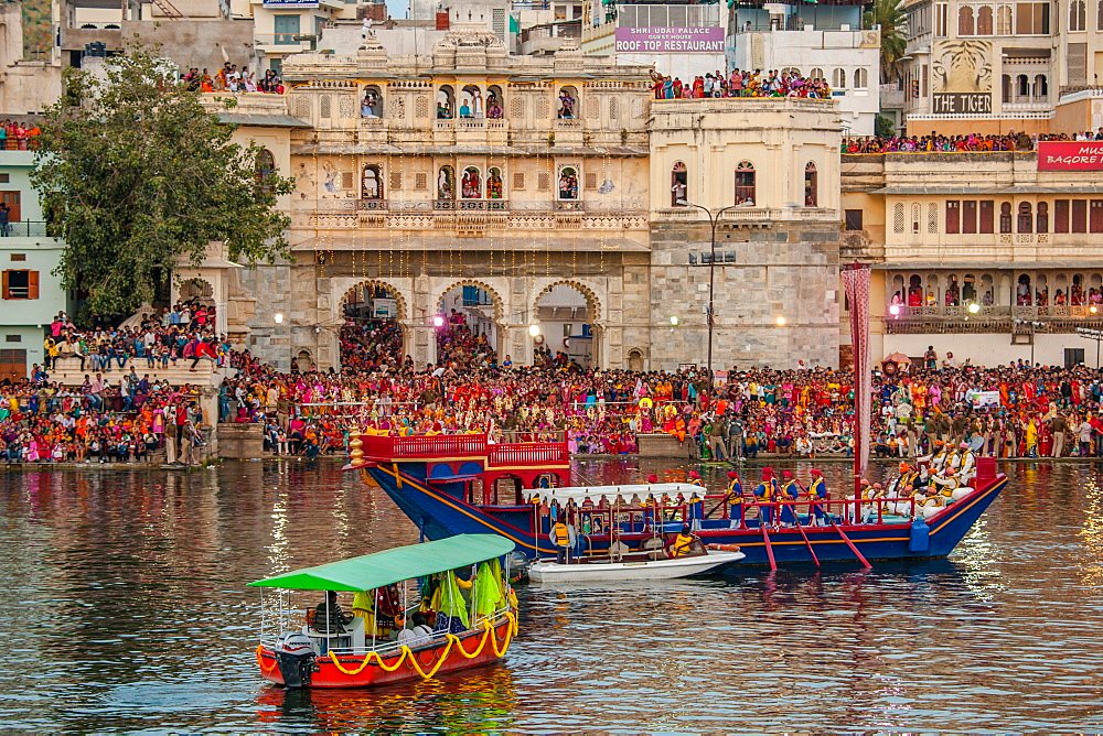 Mewar Festival, a festival women in celebration of Lord Shiva and his wife Parvati at Gangaur Ghat on the banks of Lake Pichola, Udaipur, Rajasthan, India, Asia